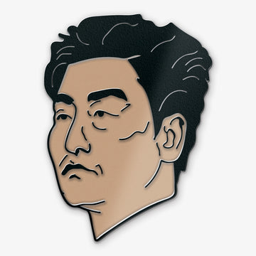Pin with a stylized portrait of Mr. Kim from the Bong Joon Ho movie Parasite on a white background